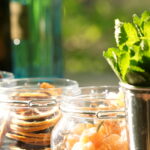 Cocktail garnishes at a bar in sunlight